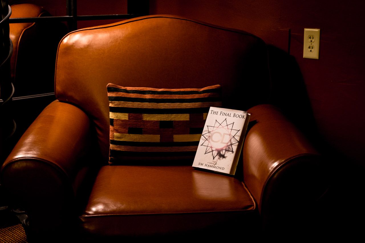 The Final Book: Gods resting on a leather chair